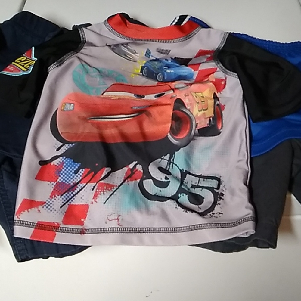 Four blue shorts and a cars t-shirt size 3t